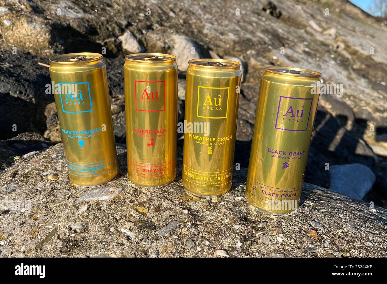 A selection of 330ml Au Vodka Pre-Mixed Cans, including Blue Raspberry, Cherryade, Pineapple Crush, and Black Grape. - Smartphone Captured Stock Image