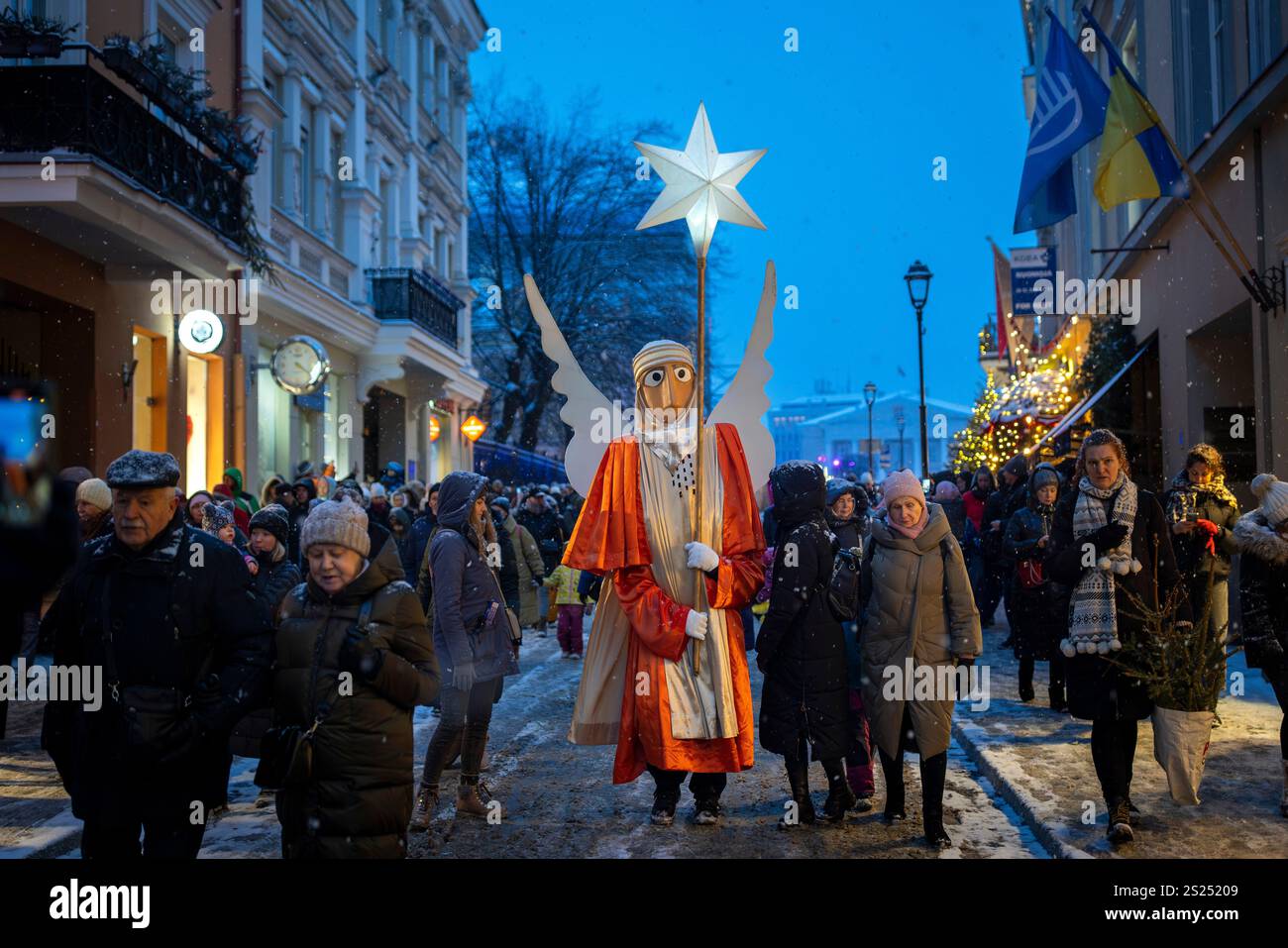 People parade through the streets as part of the Three Kings parade