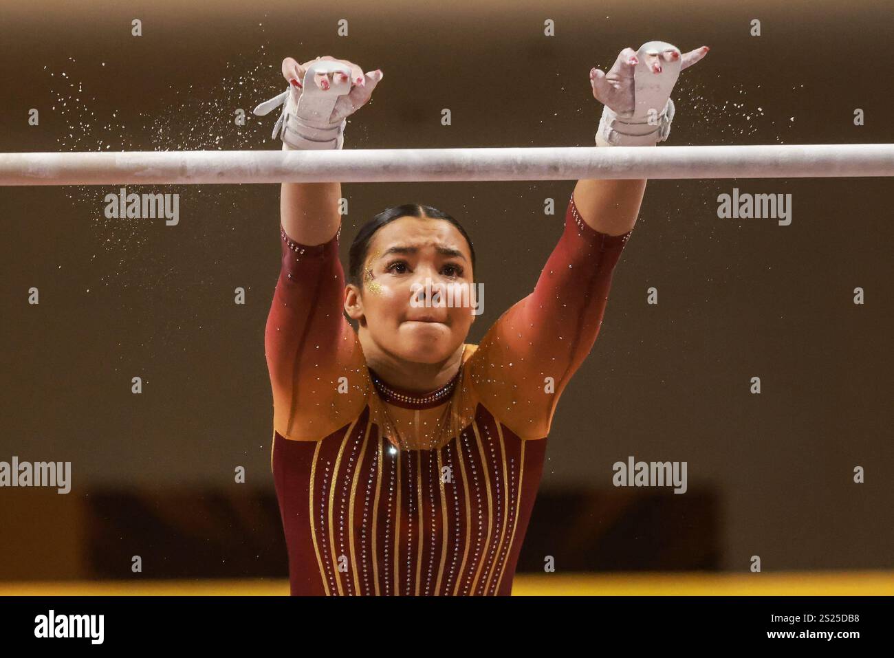 Minnesota's Mya Hooten competes in uneven bars during an NCAA