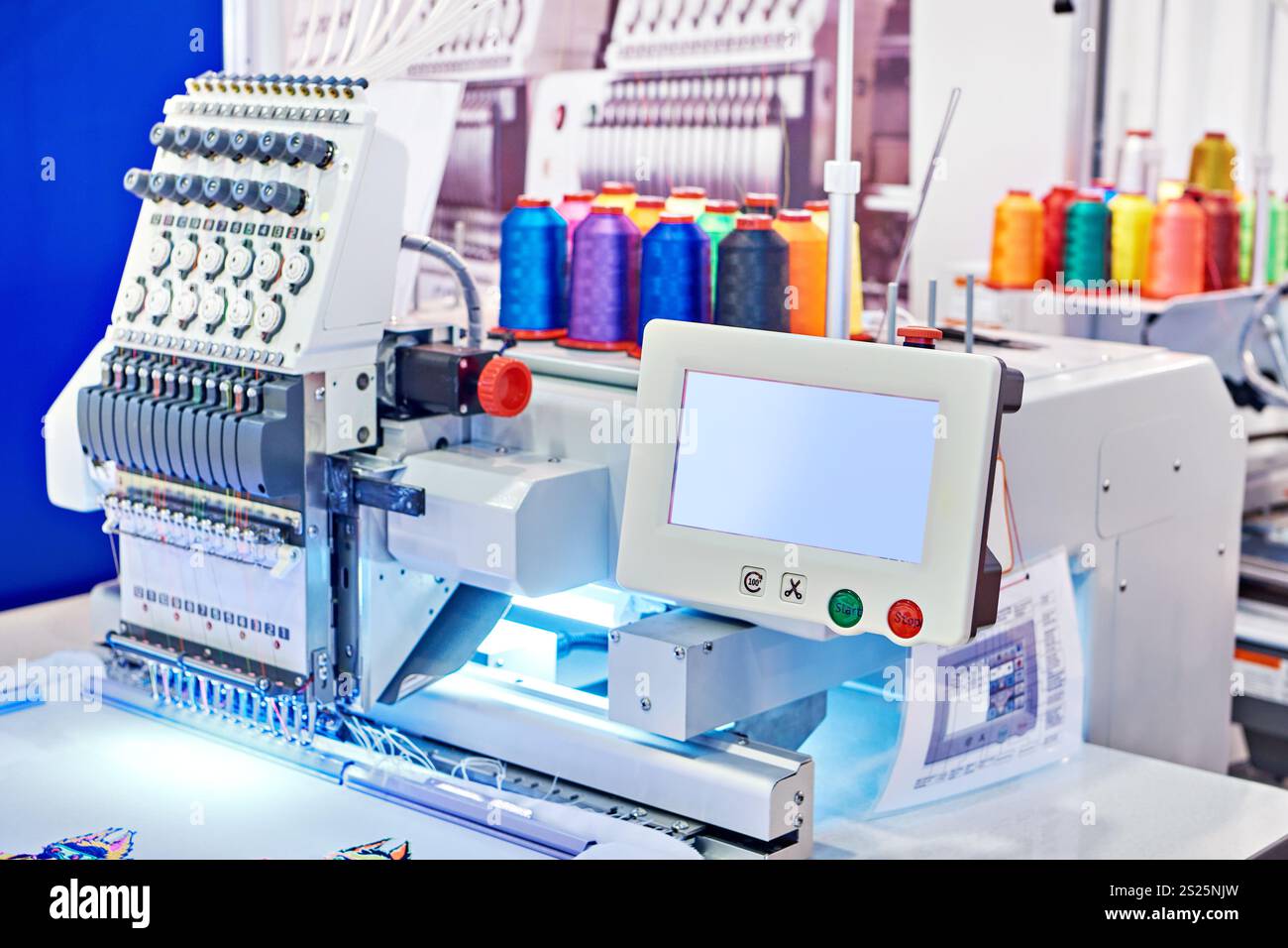 Embroidery industrial machine in sewing workshop Stock Photo