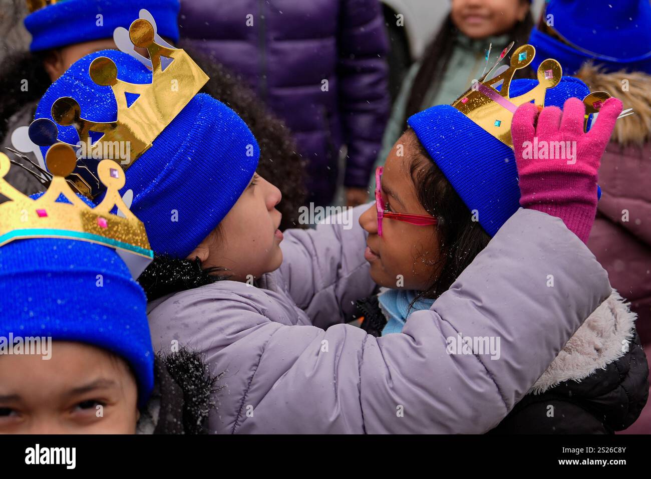 Kids adjust their crowns during El Museo del Barrio's 47th annual Three