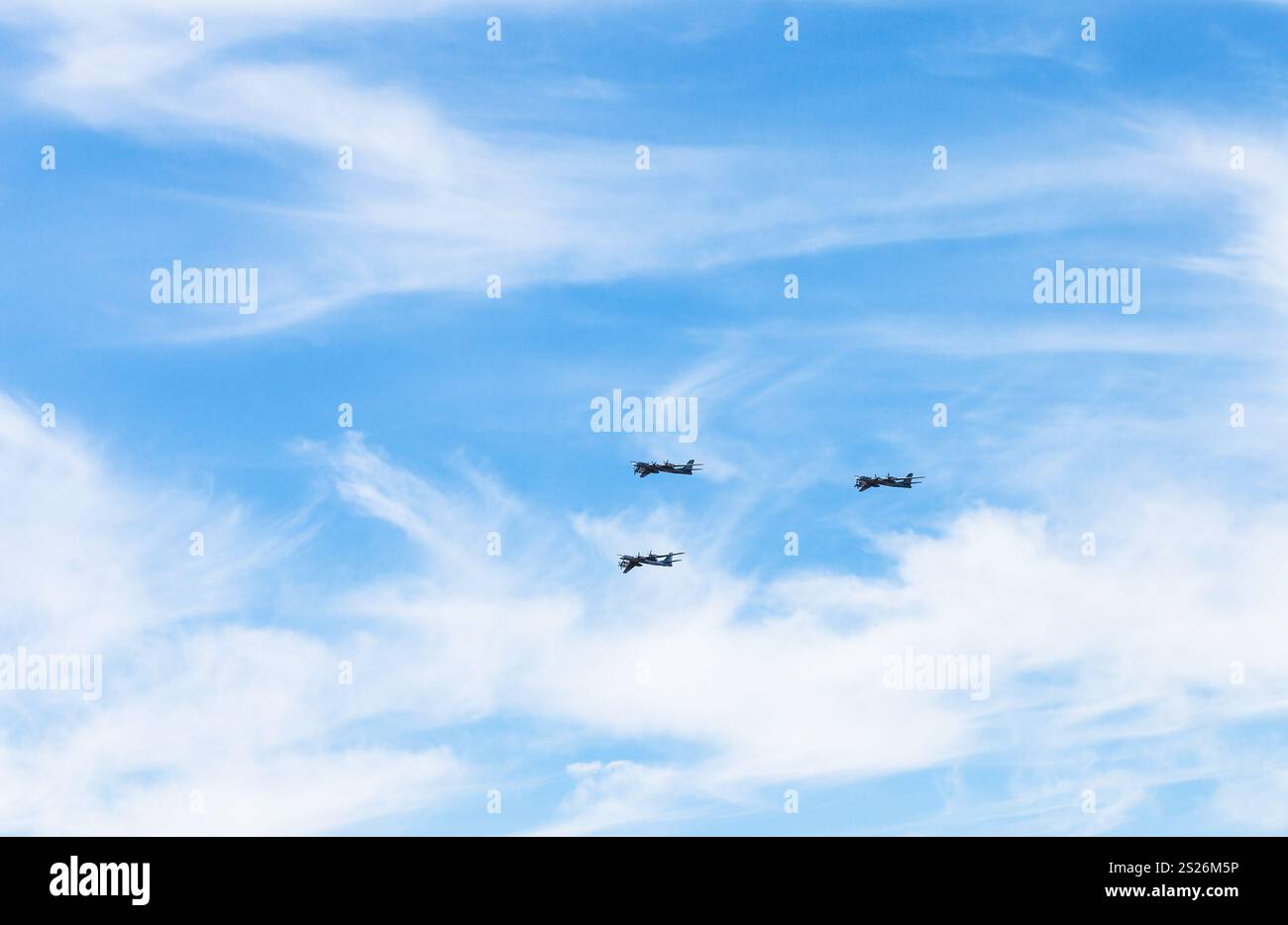 turboprop bomber aircrafts in white clouds in blue sky Stock Photo - Alamy