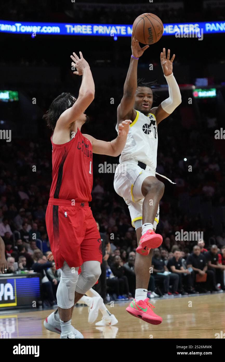 Utah Jazz guard Isaiah Collier, right, passes as Miami Heat guard Jaime