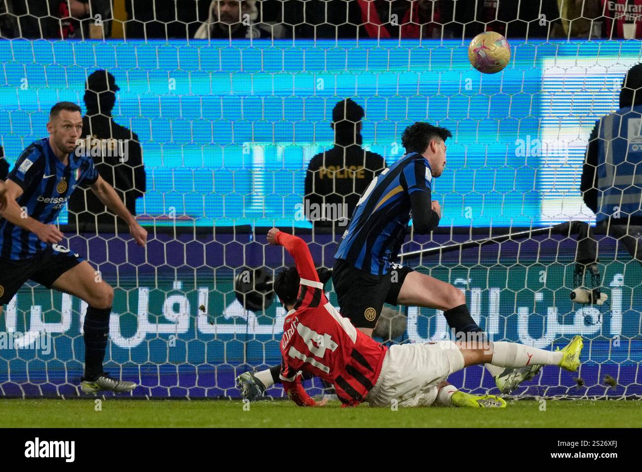 AC Milan's Tijjani Reijnders, center, misses a chance to score during