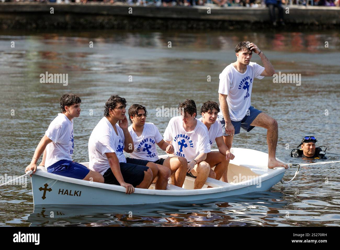 Cross retrievers wait for the cross to be thrown into the water during