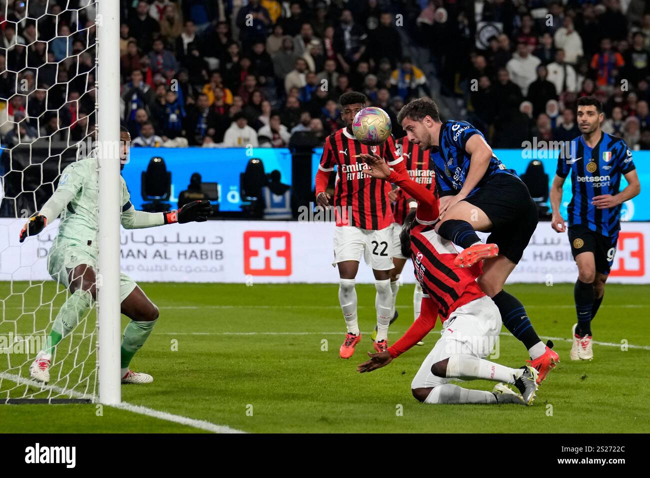 Inter Milan's Hakan Calhanoglu, right, tries to score during the