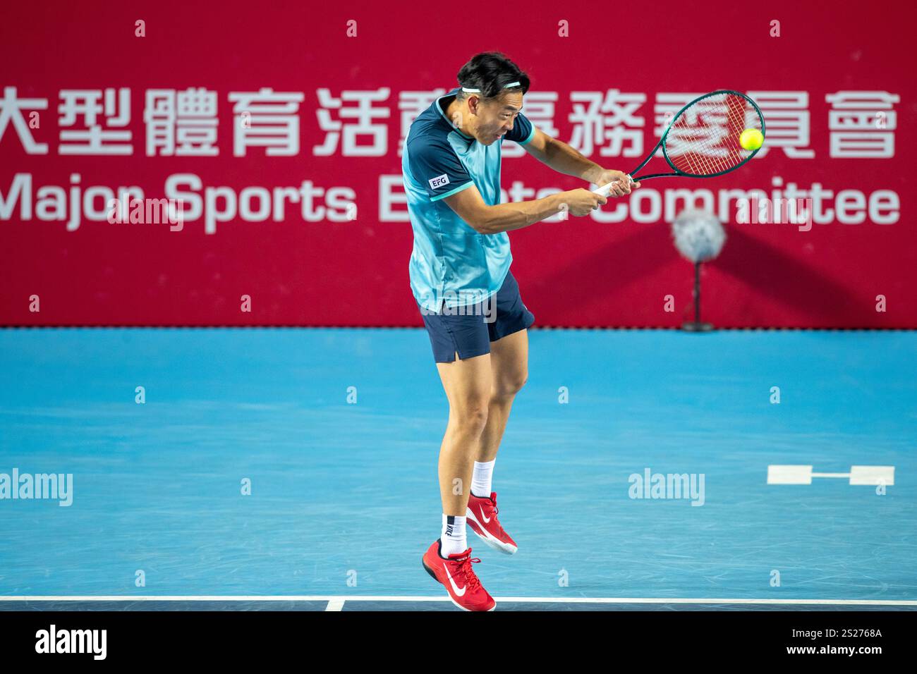 Huang Zelin from Hong Kong is hitting a tennis ball with a racquet during the US Open 2025, then thanking fans for their support.