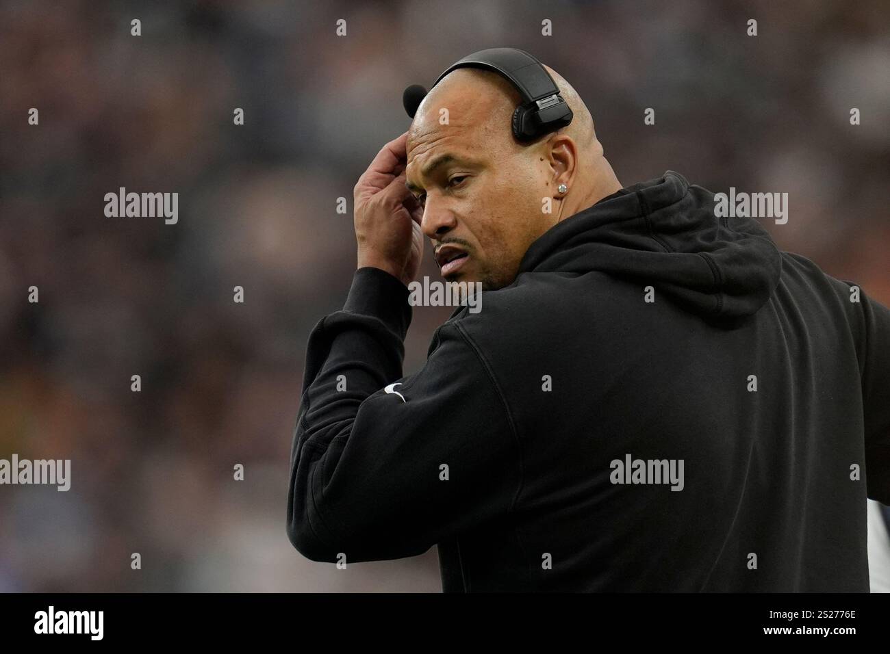 Las Vegas Raiders head coach Antonio Pierce stands on the sideline