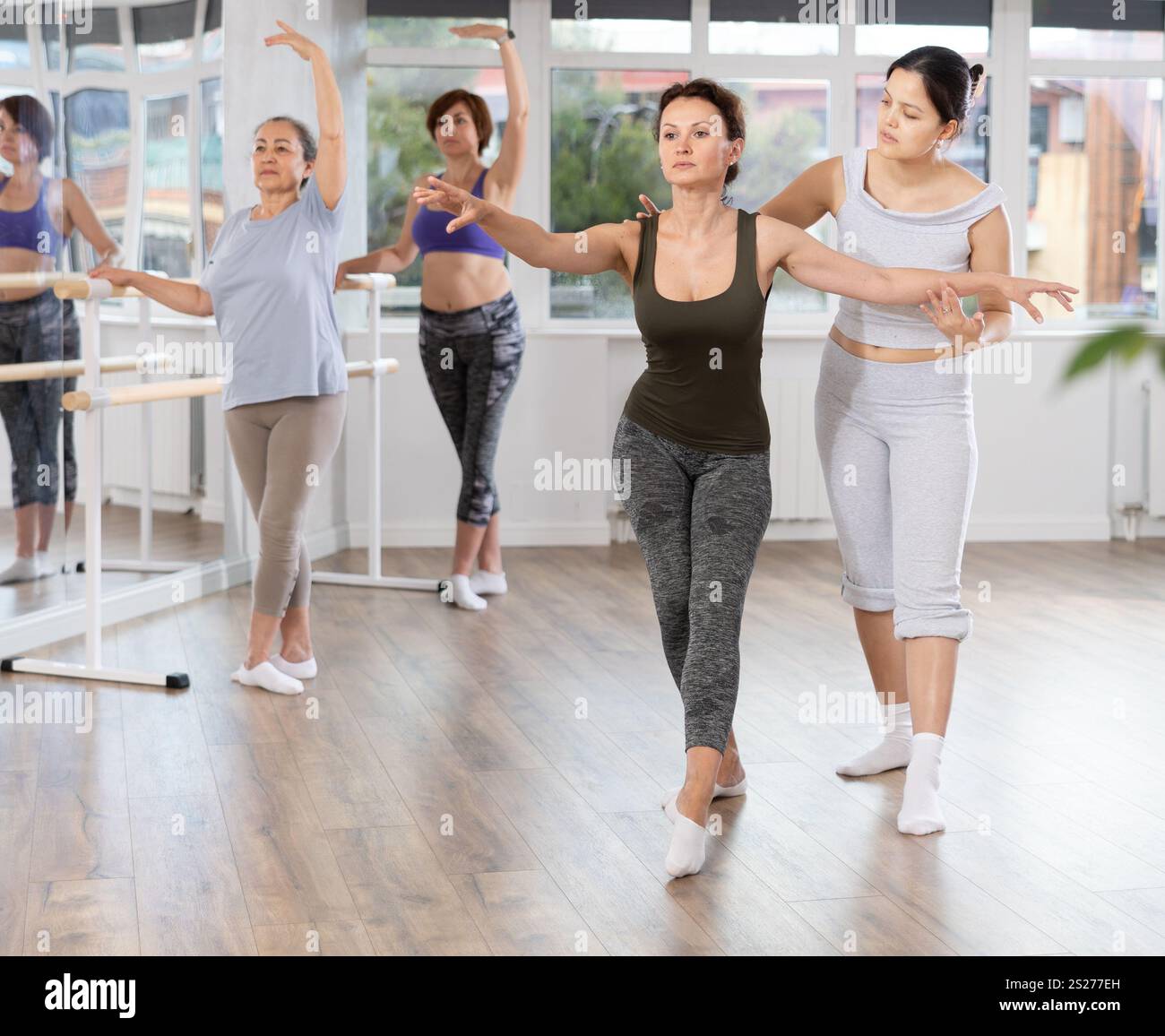 Ballet lesson for amateurs - choreographer teaches women of different ...