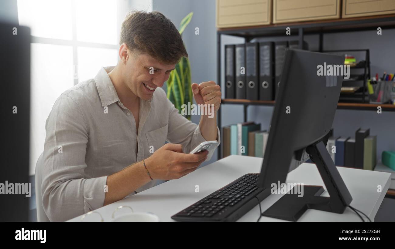 Joyful employee checking computer celebrating hi-res stock photography ...