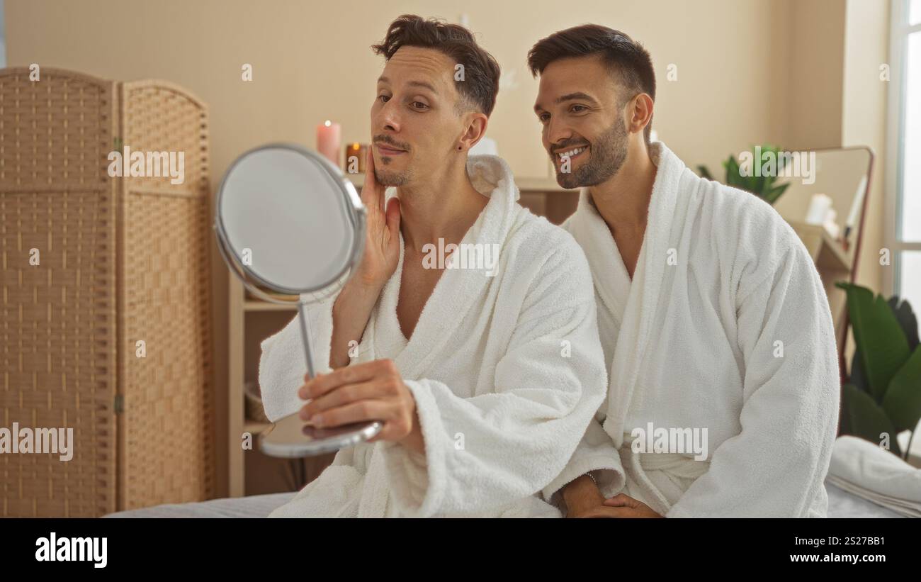 Men at spa looking into mirror wearing white robes in serene wellness ...