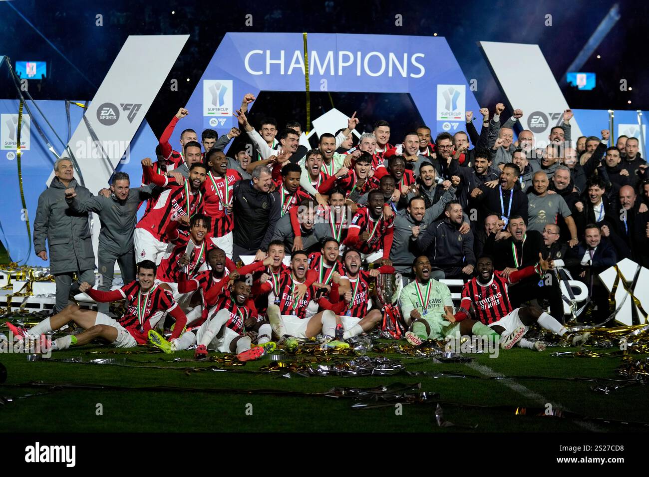AC Milan's team celebrates after winning the Italian Super Cup final
