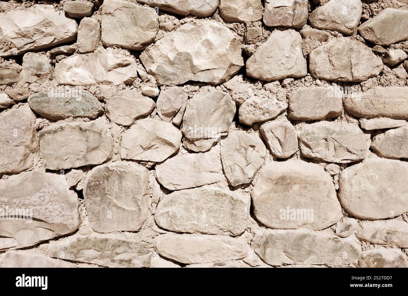 Old rough stone wall, background wallpaper Stock Photo - Alamy