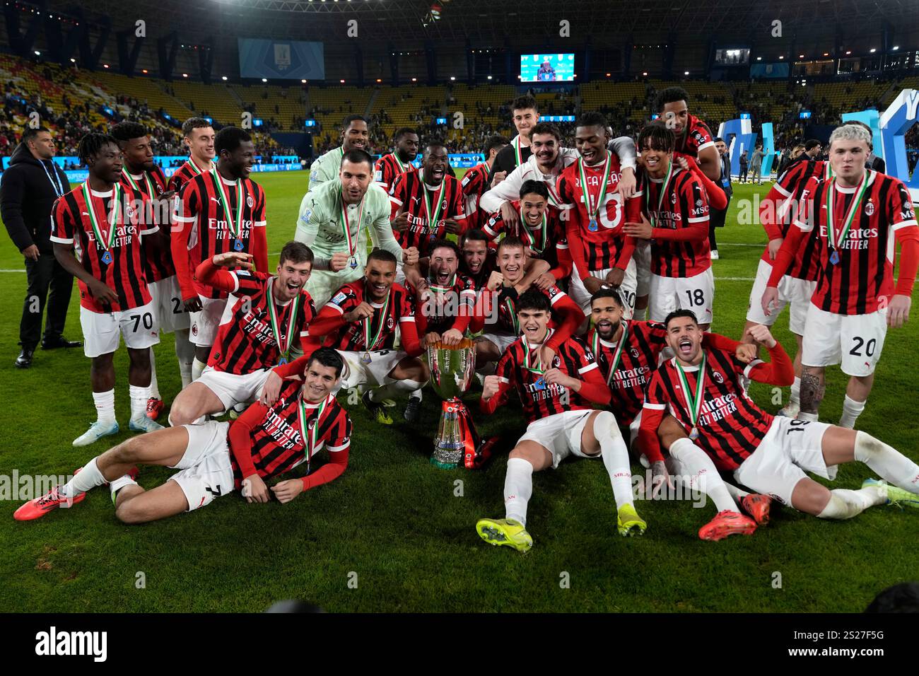 AC Milan's team celebrates after winning the Italian Super Cup final