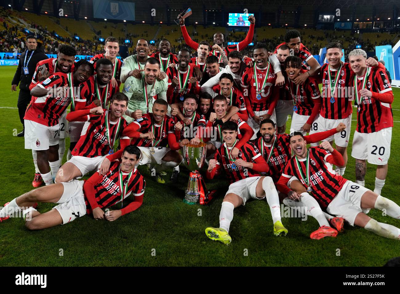 AC Milan's team celebrates after winning the Italian Super Cup final