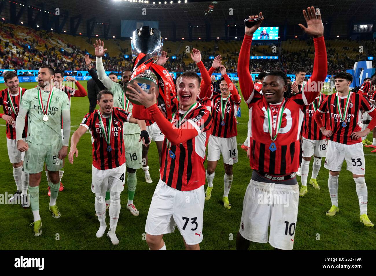 AC Milan's Francesco Camarda celebrates with teammates after winning