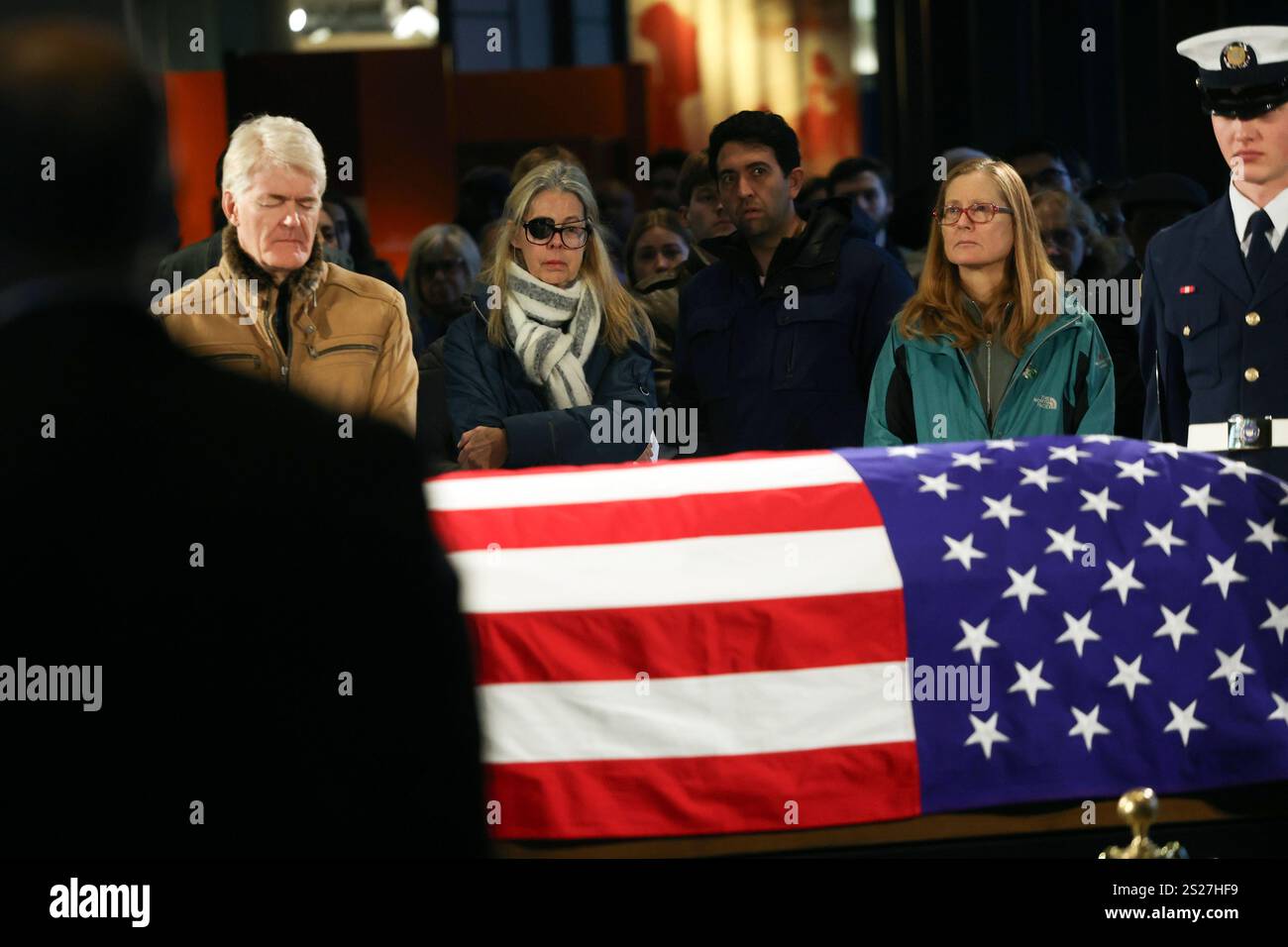 Mourners view the casket of former President Jimmy Carter as he lies in