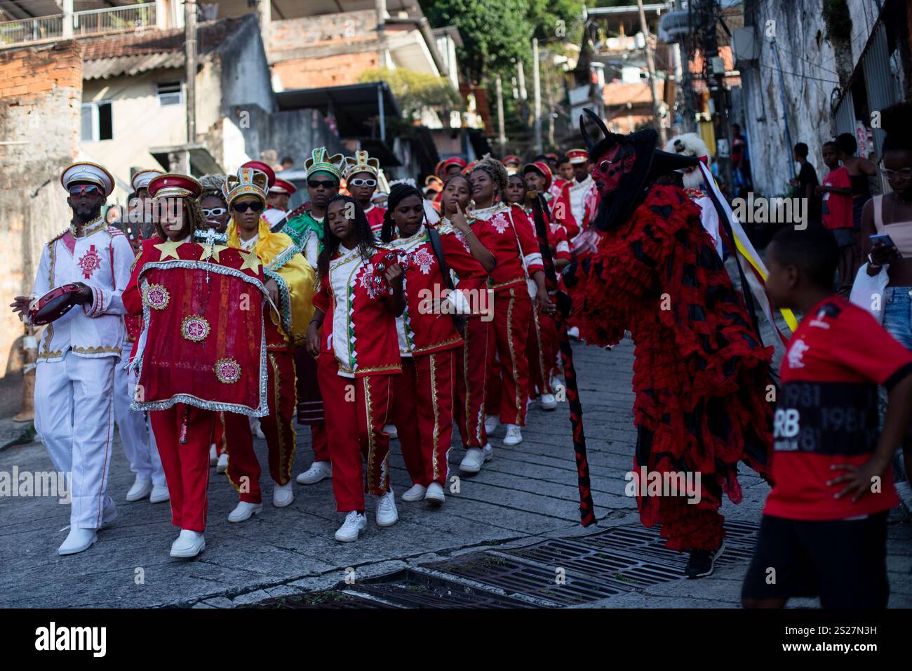 The Bright Star of Bethlehem parade through a street during a Three