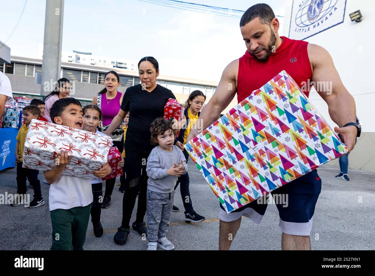 A family reacts to the presents gifted to them during a Three Wise Men