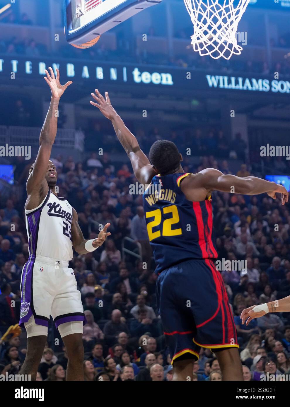 Sacramento Kings guard Keon Ellis, left, shoots over Golden State