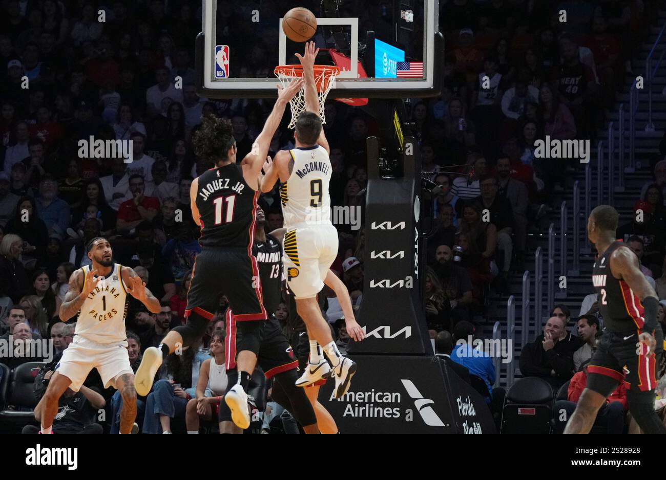 Indiana Pacers guard T.J. McConnell (9) shoots as Miami Heat guard