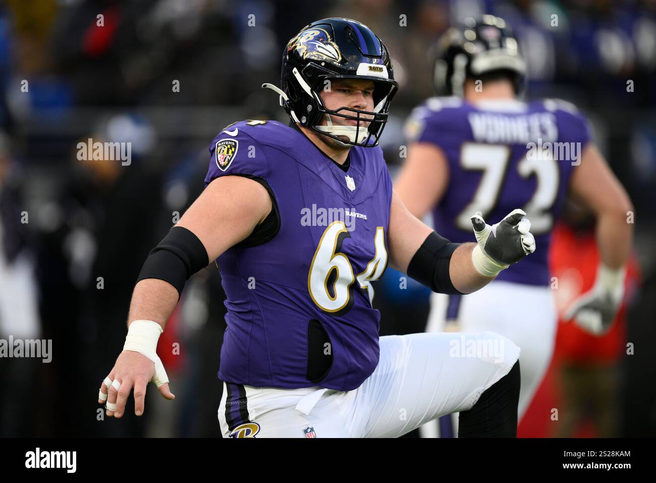 Baltimore Ravens center Tyler Linderbaum (64) works out before an NFL ...