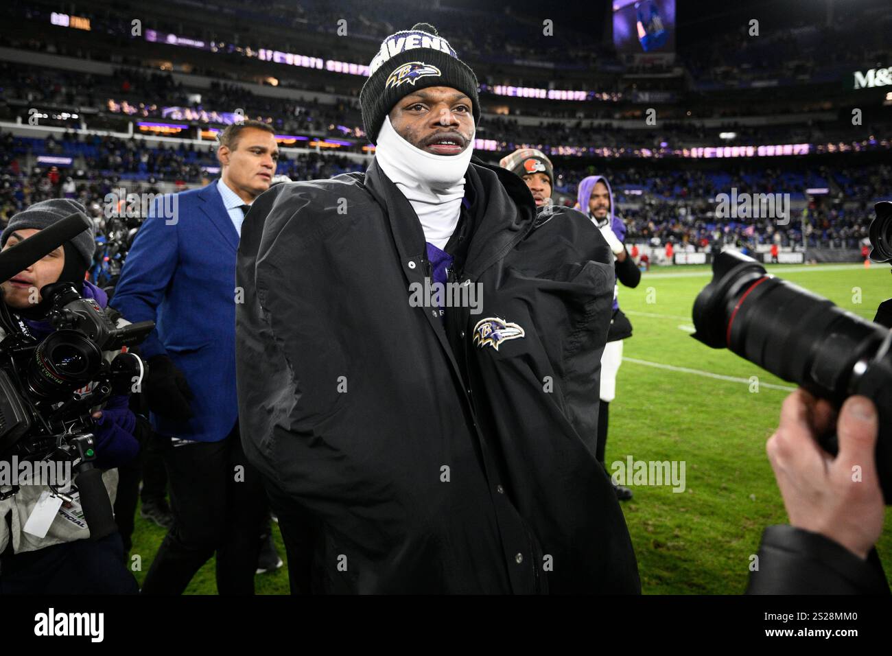 Baltimore Ravens quarterback Lamar Jackson (8) walks on the field after