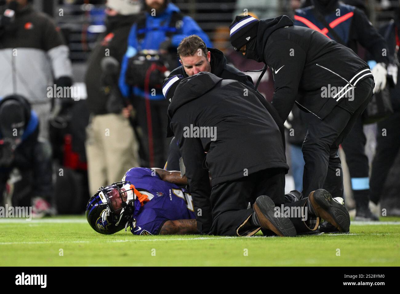 Baltimore Ravens wide receiver Zay Flowers (4) is seen by trainers