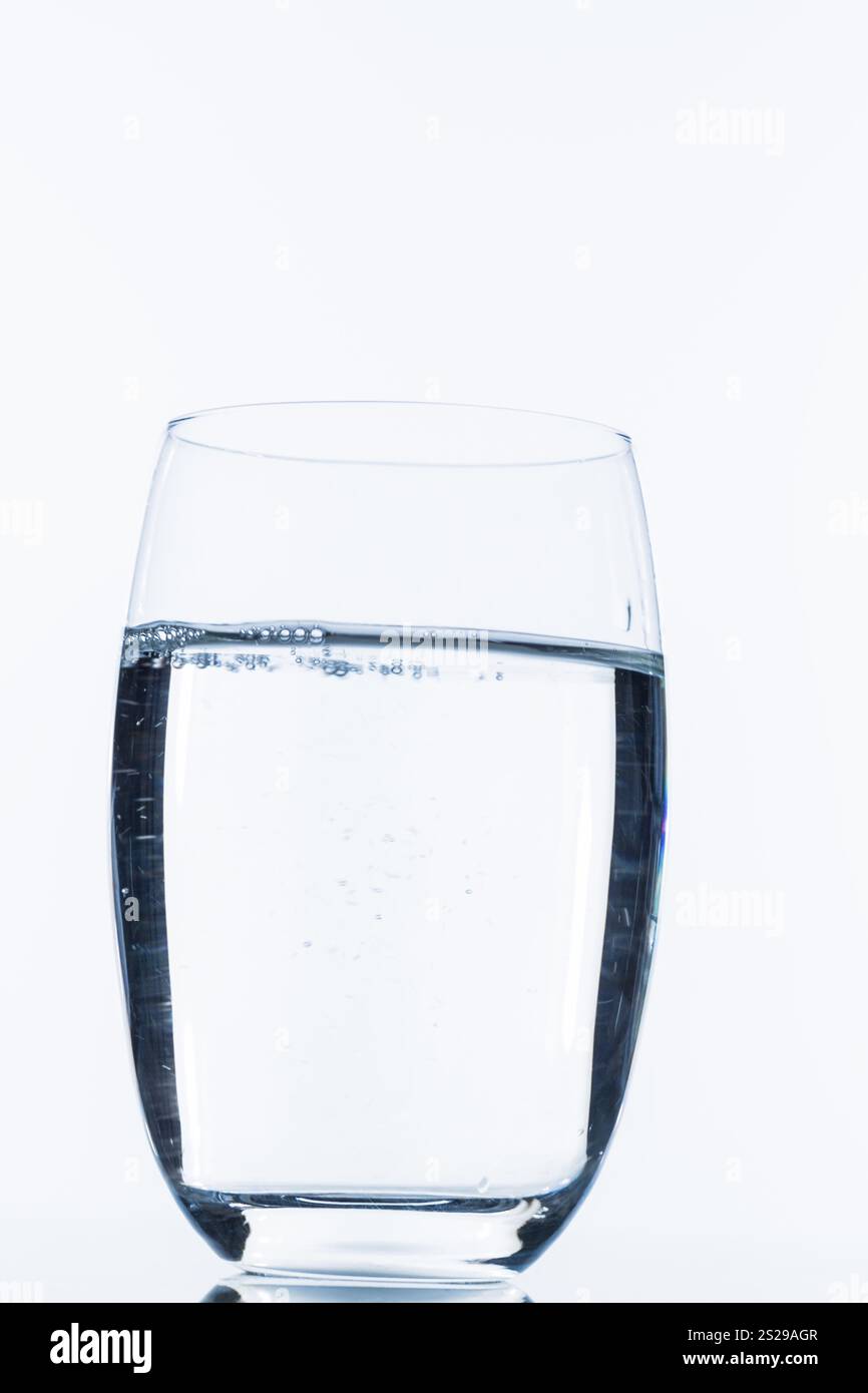Glass with water, symbolic photo for drinking water, freshness, demand and consumption Stock Photo