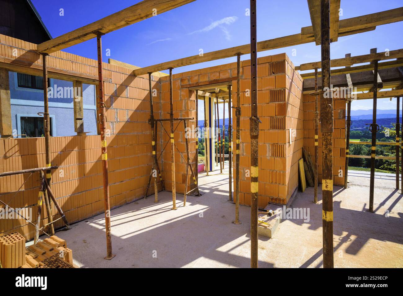 The shell of a detached house made of solid brick Stock Photo - Alamy