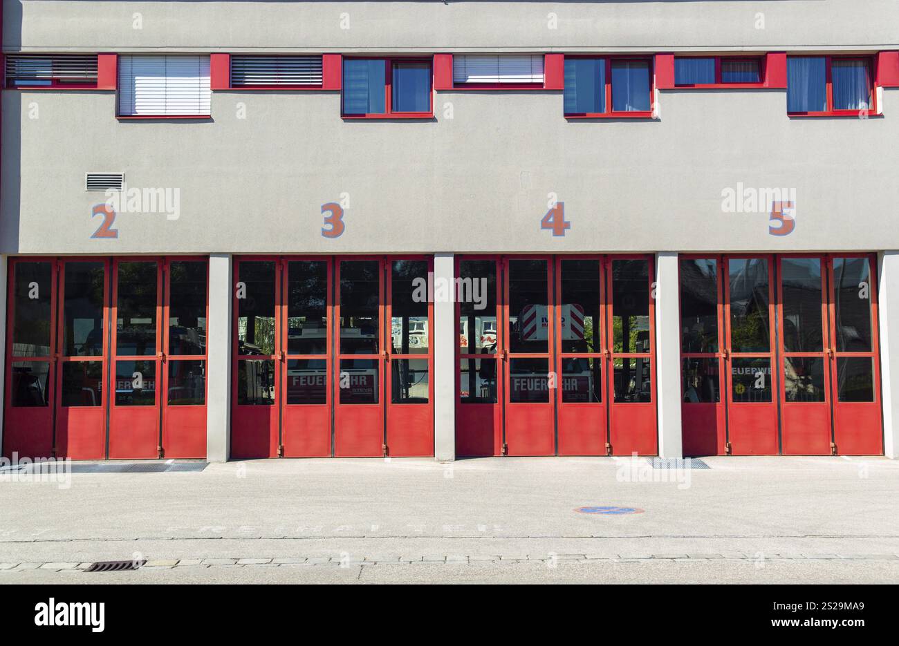 Numbered exits in a fire brigade armoury Stock Photo - Alamy