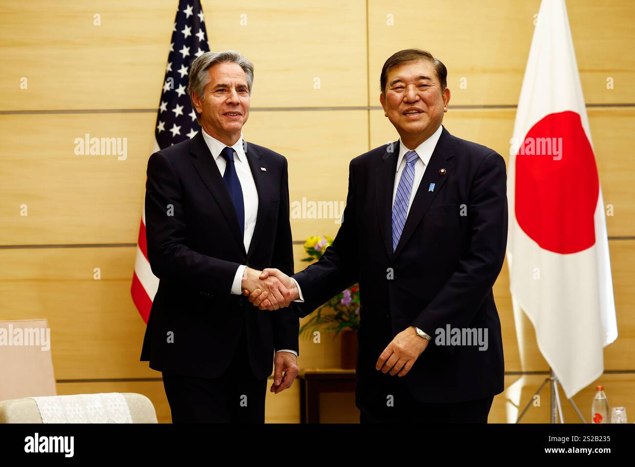U.S. Secretary of State Antony Blinken, left, shakes hands with ...