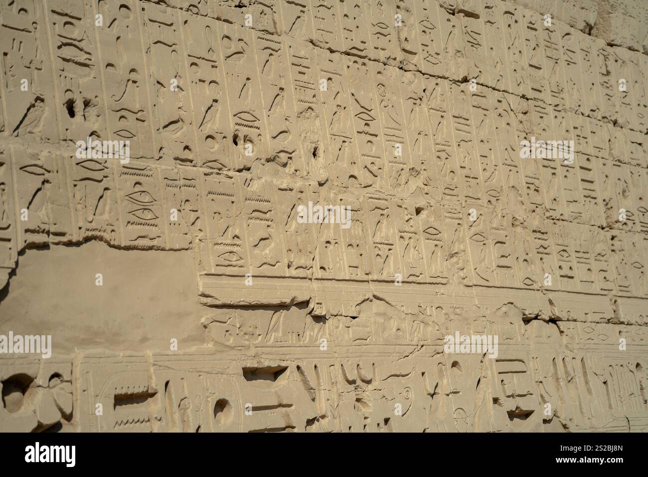 Ancient Egyptian ancient wall with carved hieroglyphs in Luxor Stock ...