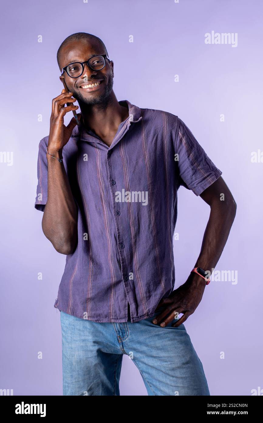 Positive african man holding hi-res stock photography and images - Alamy