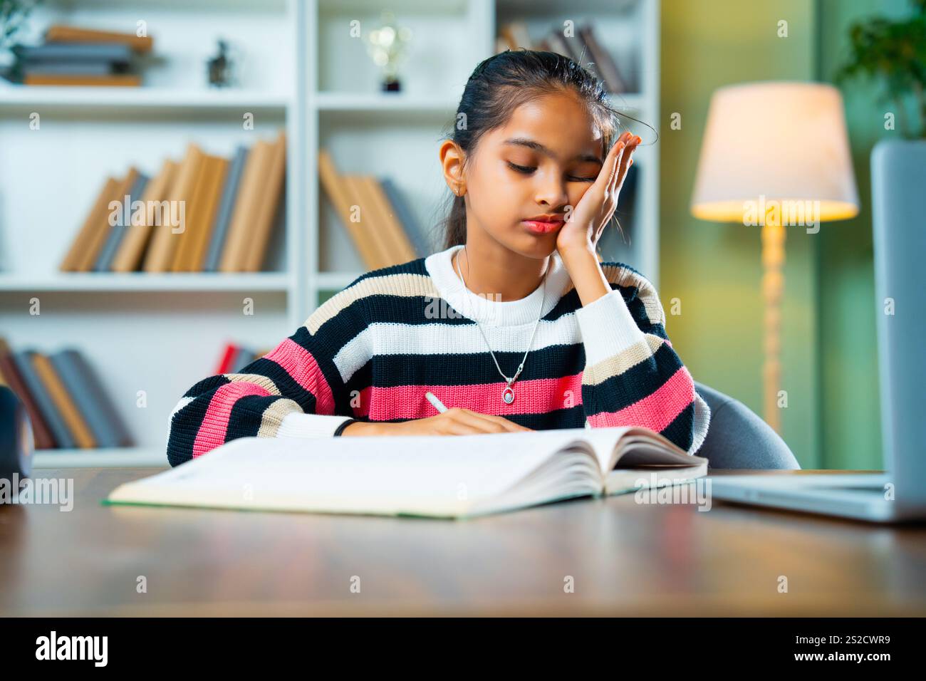 Stressed or Tired Indian Asian Cute Little Girl Sitting at Table in ...