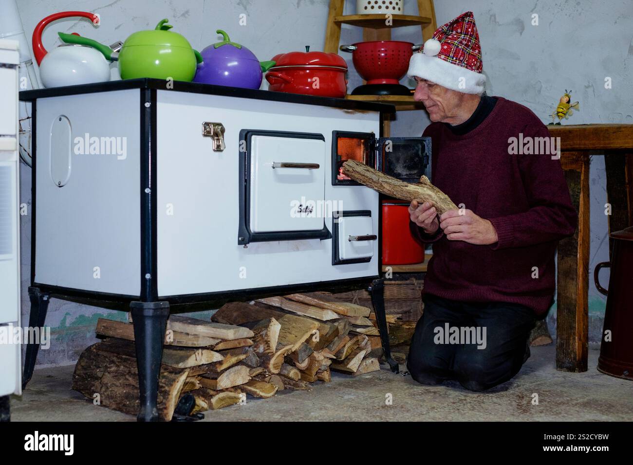putting-log-into-wood-burner-hi-res-stock-photography-and-images-alamy