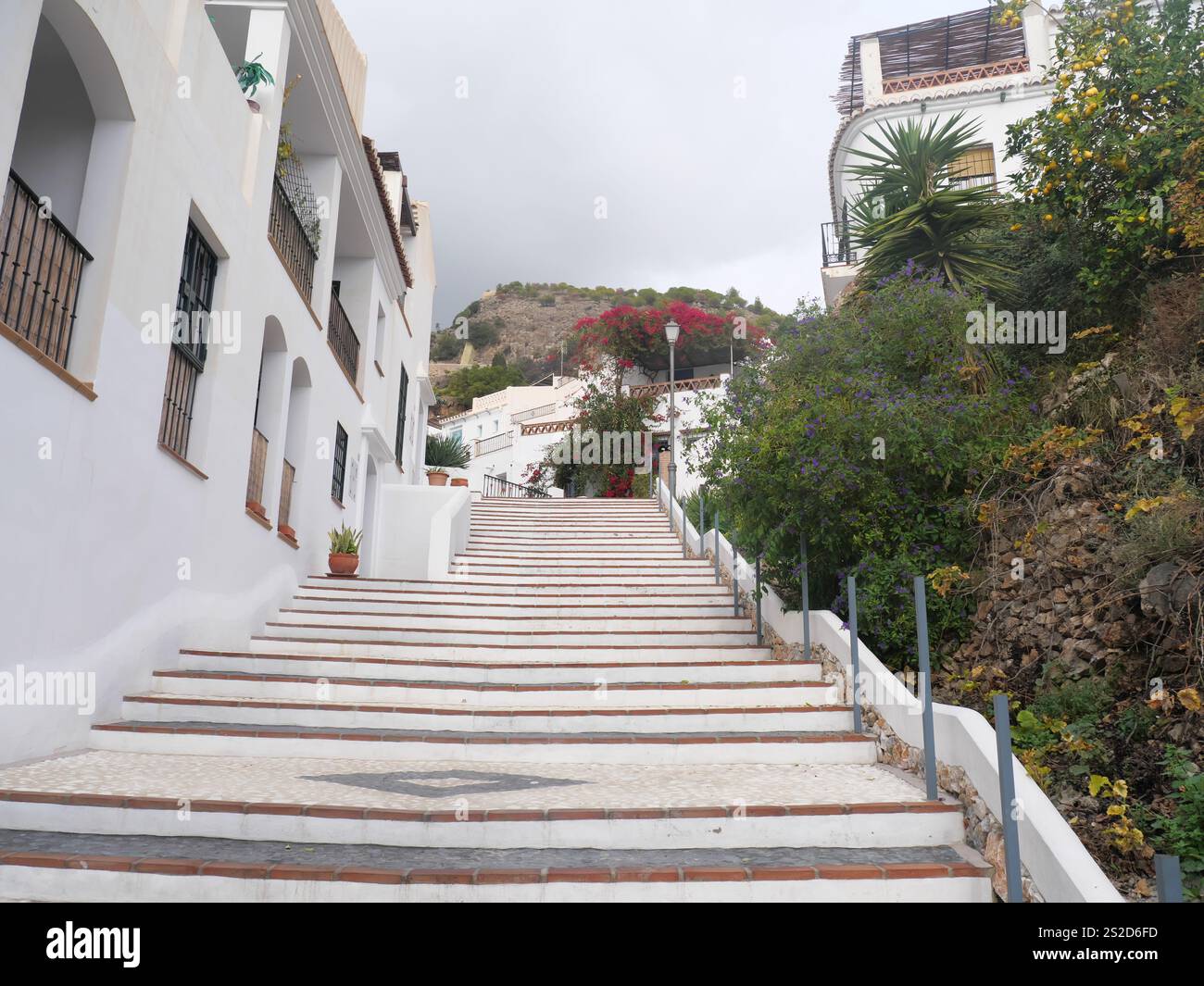 Stairs between houses connect the paths in Competa a white town in ...