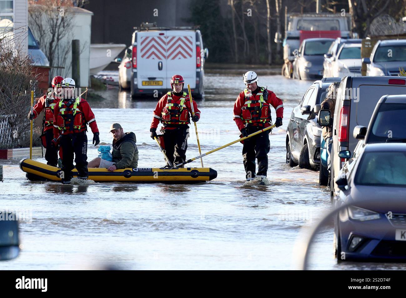 Firemen help residents in the flooded area of Barrow Upon Soar, England