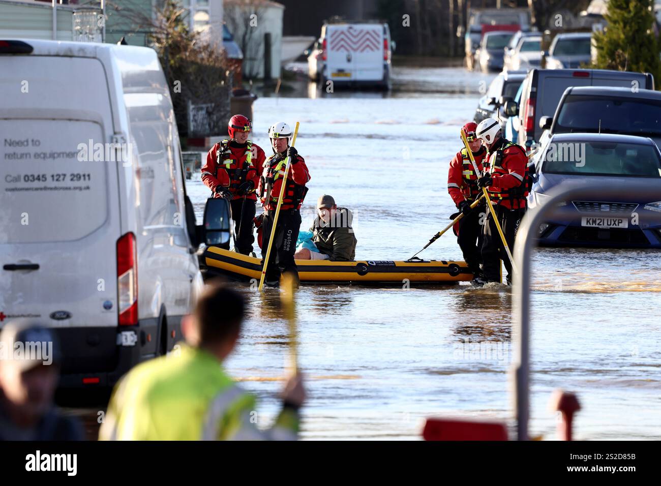 Firemen help residents in the flooded area of Barrow Upon Soar, England