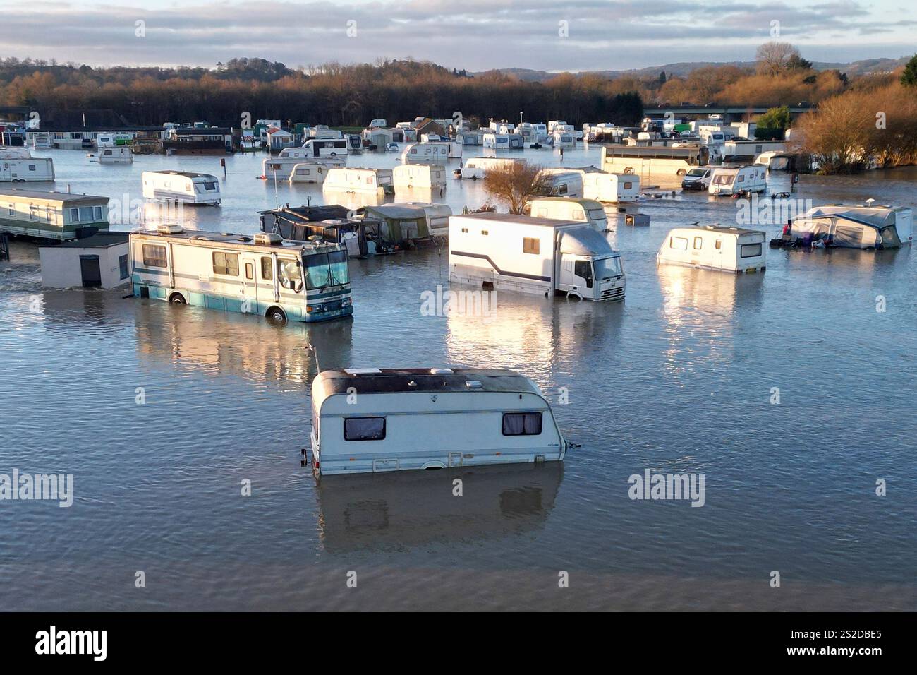 Caravans and cars sit in the floods of the river Soar in Barrow Upon