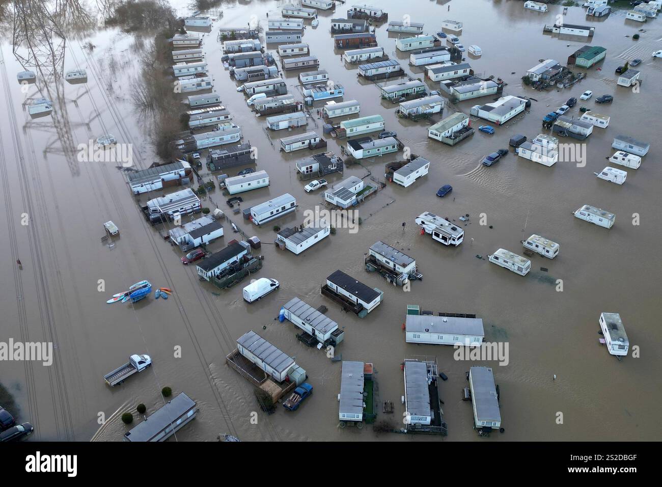 Caravans and cars sit in the floods of the river Soar in Barrow Upon