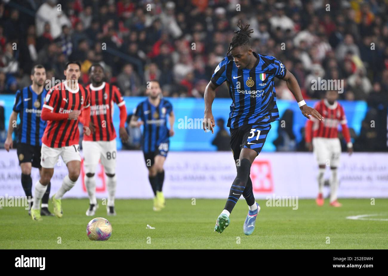 RIYADH, SAUDI ARABIA - JANUARY 6: Yann Aurel Bisseck of FC Internazionale in action ,during the Italian Super Cup Final match between FC Internazionale and AC Milan at Al-Awwal Park Stadium on January 6, 2025 in Riyadh, Saudi Arabia. (Photo by MB Media) Stock Photo