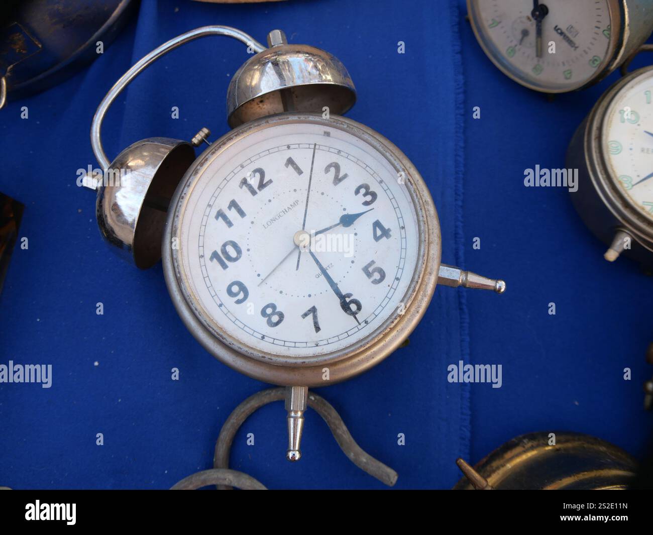 Old alarm clock in the flea maket Stock Photo - Alamy
