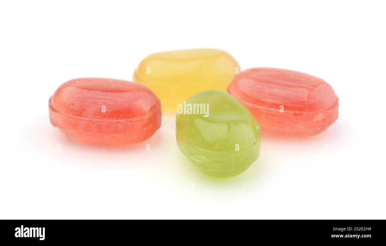 Several multicolored fruit candies isolated on white. Stock Photo