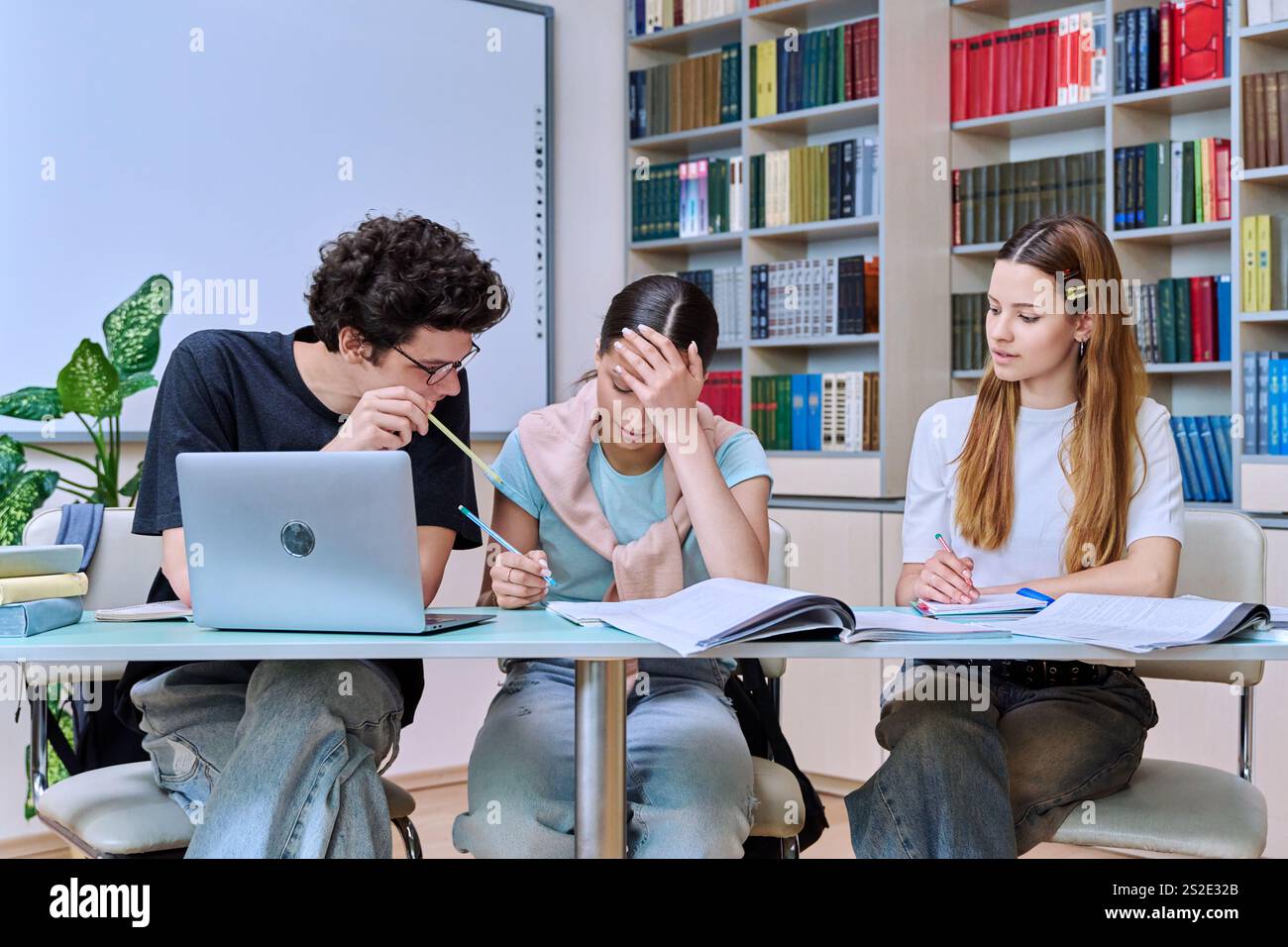 Group of high school students studying in library classroom Stock Photo ...