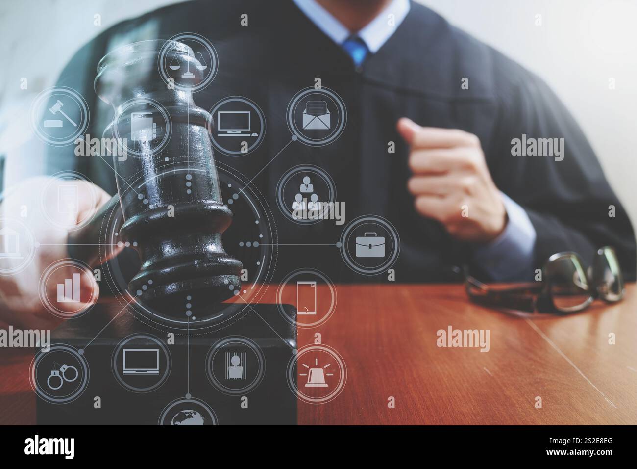 Justice Tablet justice and law concept.Male judge in a courtroom striking the gavel ...