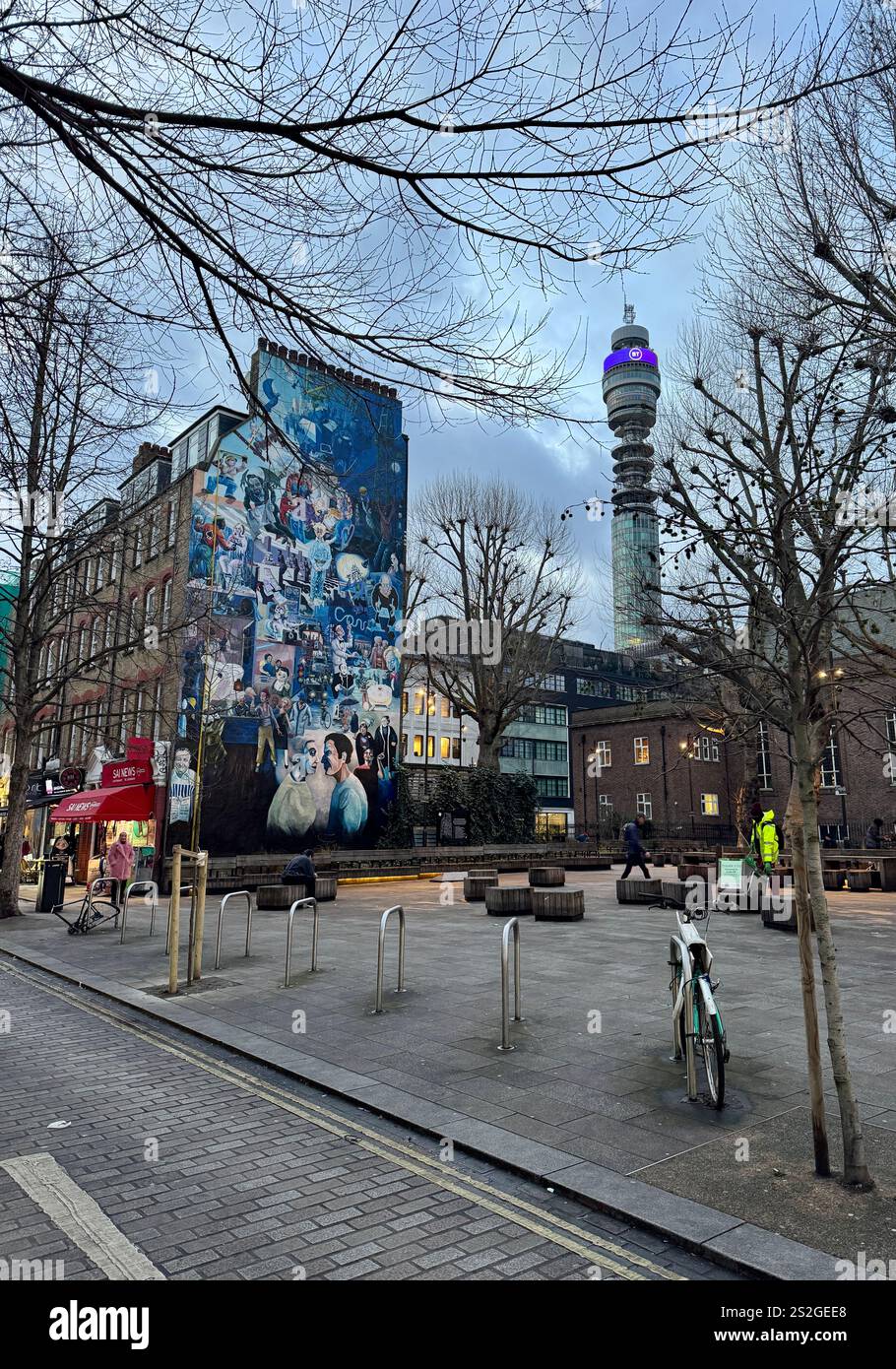 Whitfield Gardens off Tottenham Court Rd, London, showing the Fitzrovia Mural and the BT Tower, on a grey winter day. Cycle lock up points. WC1E - Smartphone Captured Stock Image