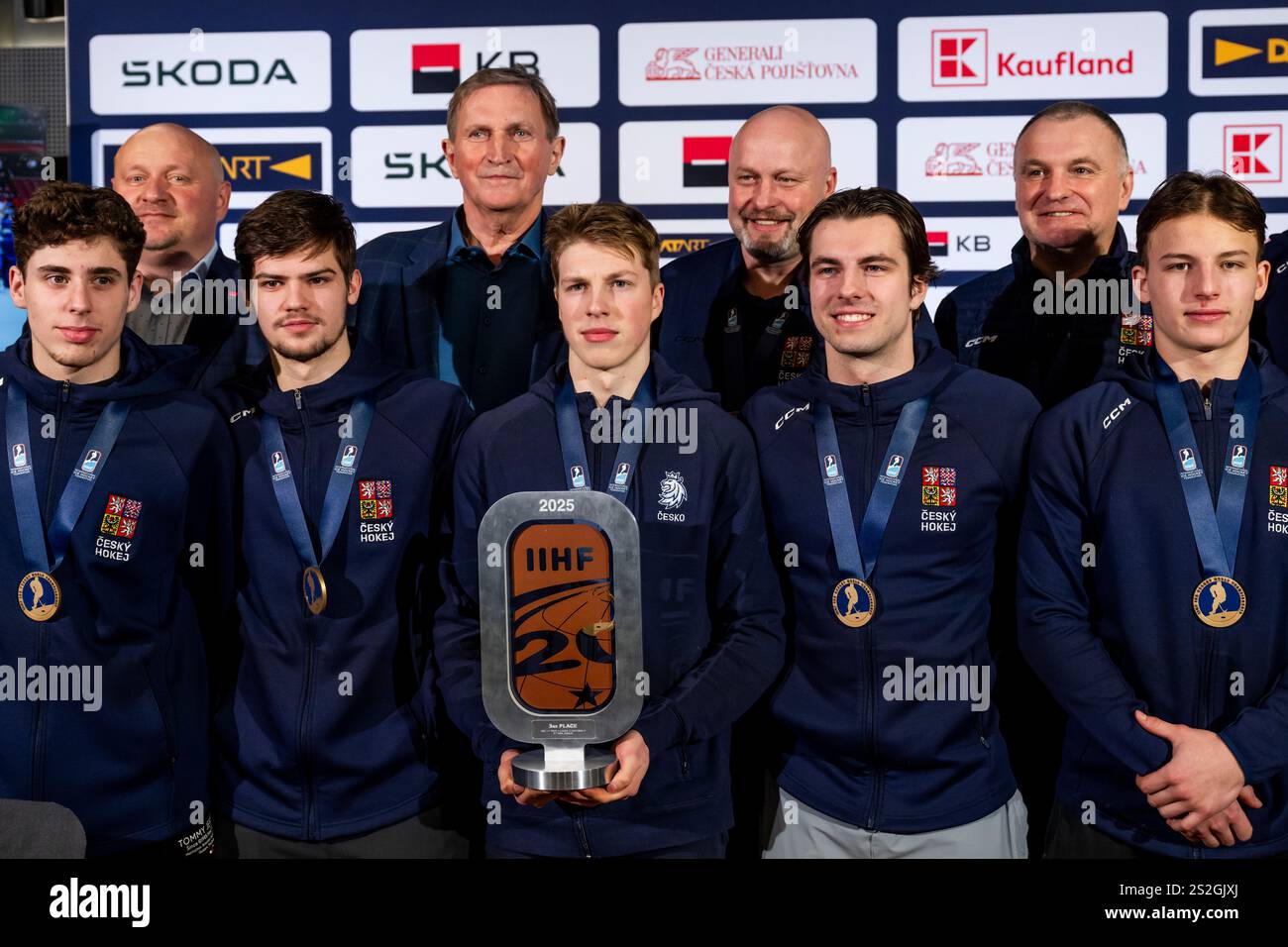 The Czech national junior hockey team poses with their bronze medals