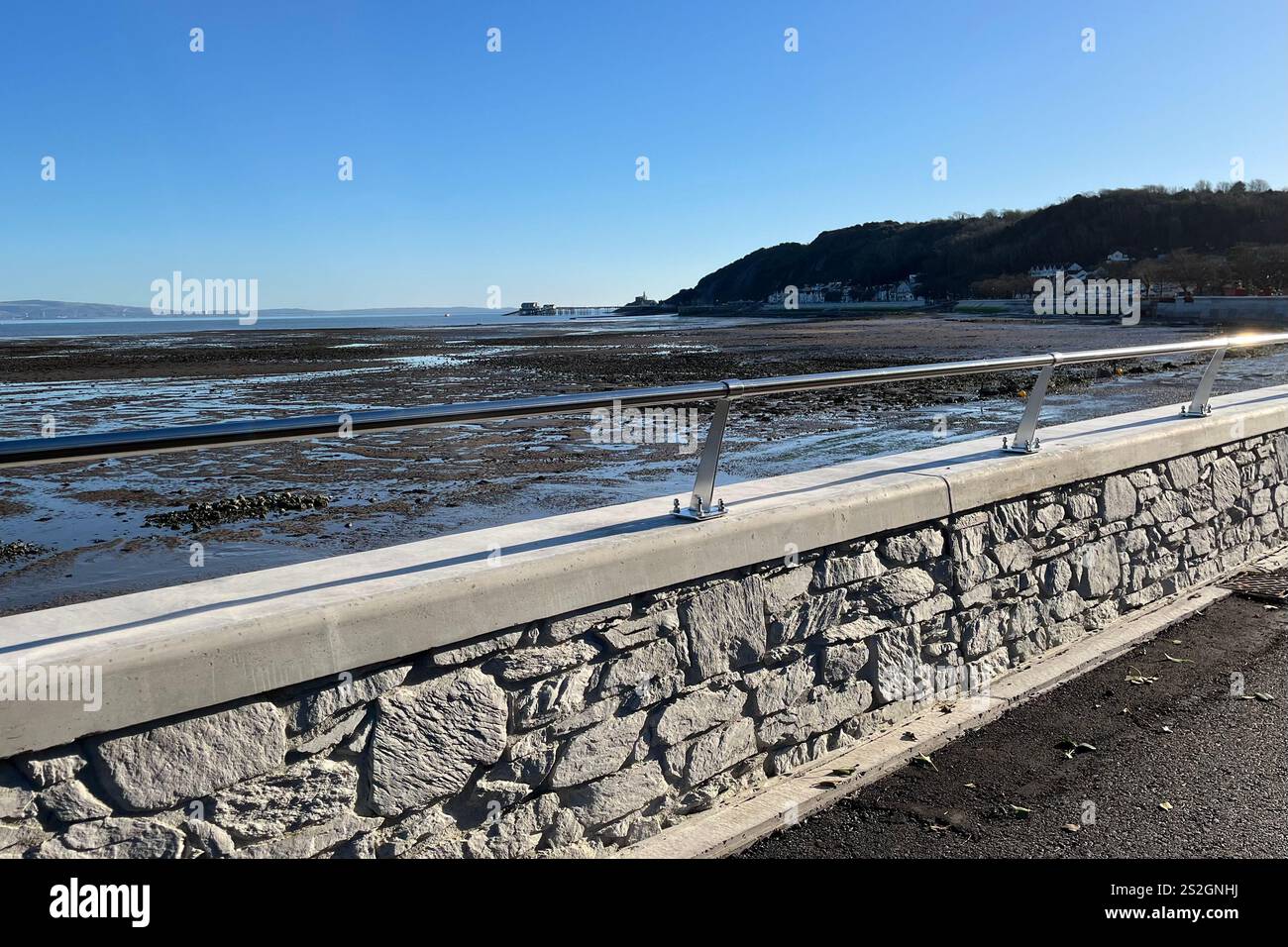 Looking towards Mumbles Pier from the Mumbles Prom, which was recently refurbished as part of the Mumbles Coastal Protection Scheme. 2nd January 2025. - Smartphone Captured Stock Image
