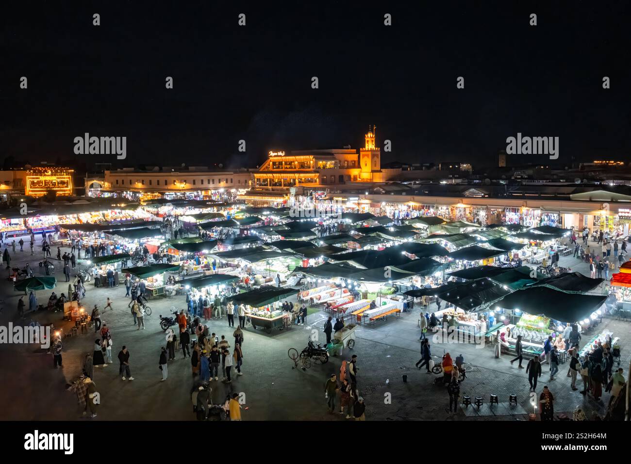 Marrakesh Morocco. A view of illuminated busy food stalls located in the Jemaa el-Fnaa square Marrakech .The view is at night above the square Stock Photo